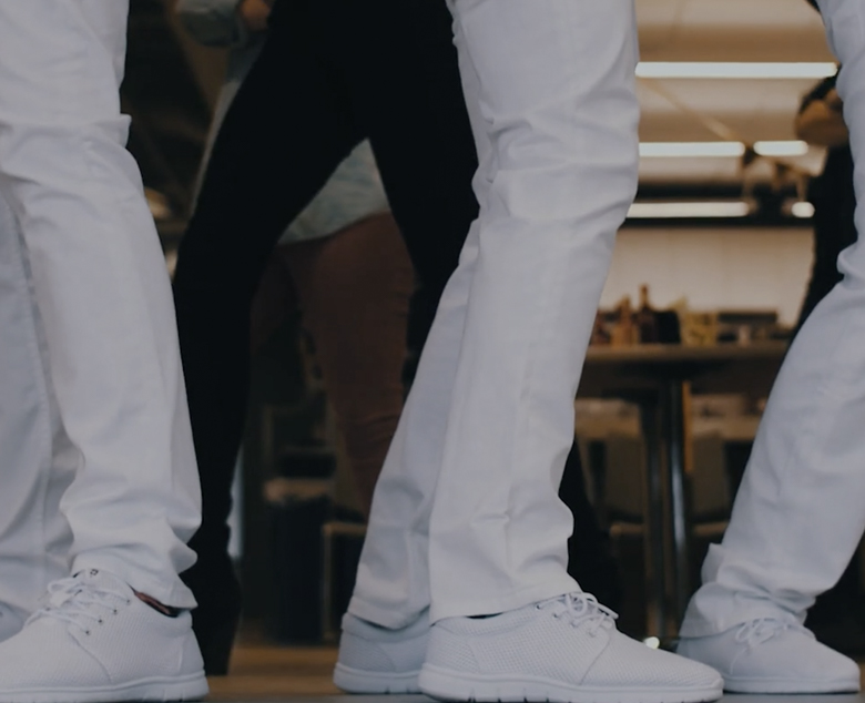 dancing legs in white jeans