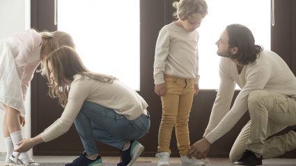 family putting on shoes