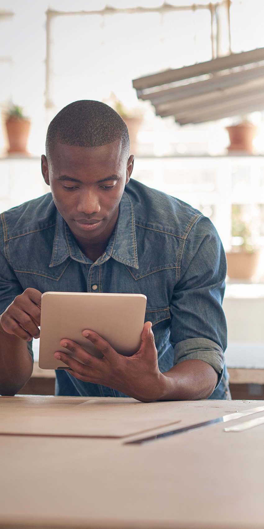 shop owner on tablet
