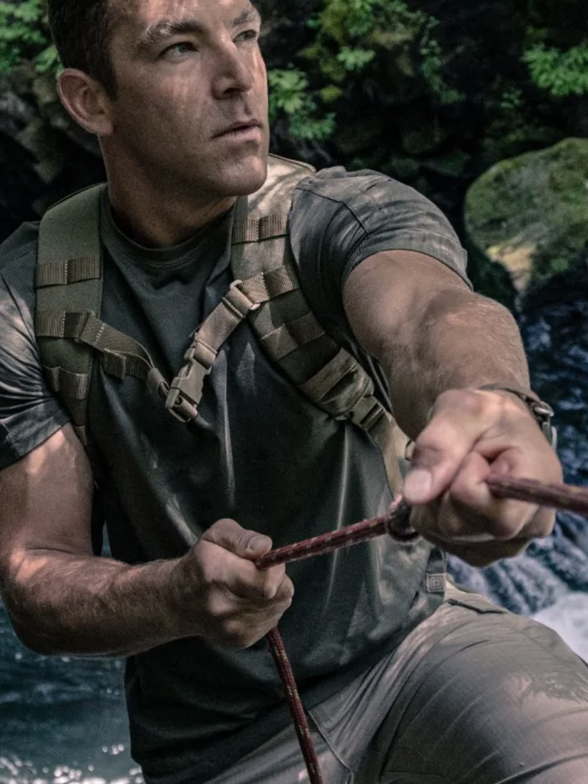 Man outdoors with tactical gear