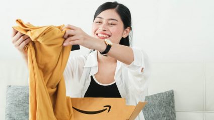 Woman opening Amazon package in her home