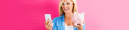 blonde woman holding piggy bank and phone on hot pink background