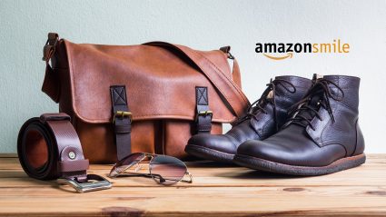 Shoes, belt and carrying bag sitting on tabletop with AmazonSmile logo