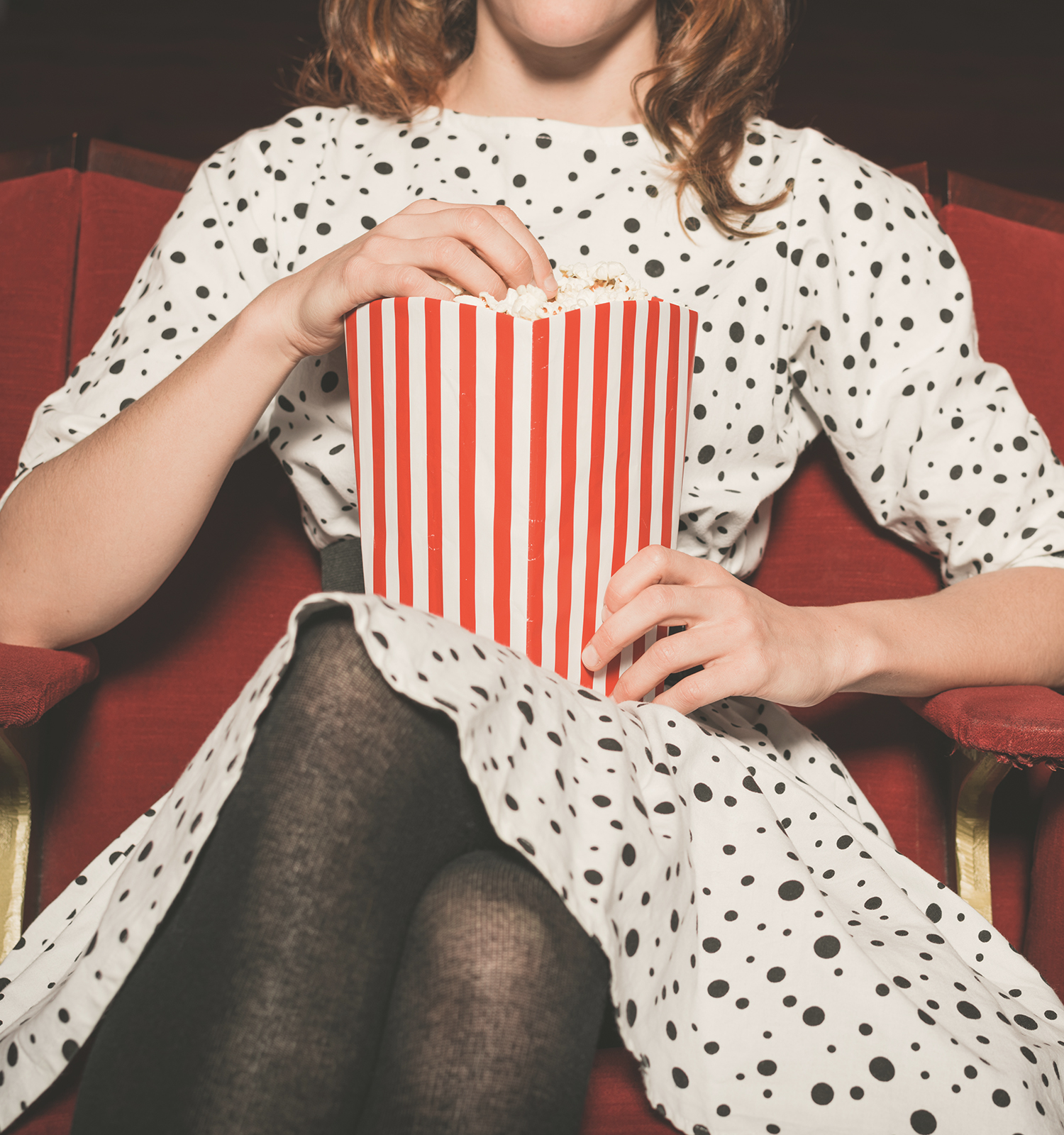 Person eating popcorn