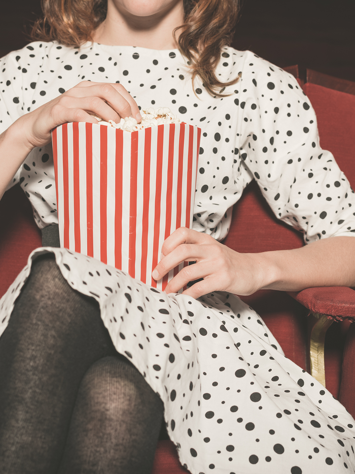 Person eating popcorn