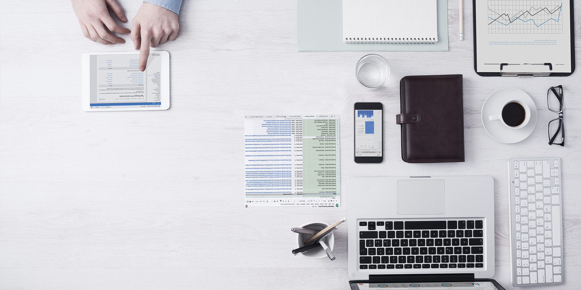 top view of desk with google analytics and spreadsheets