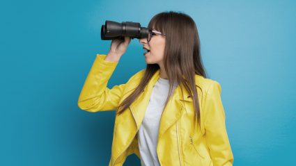 Woman looking through binoculars