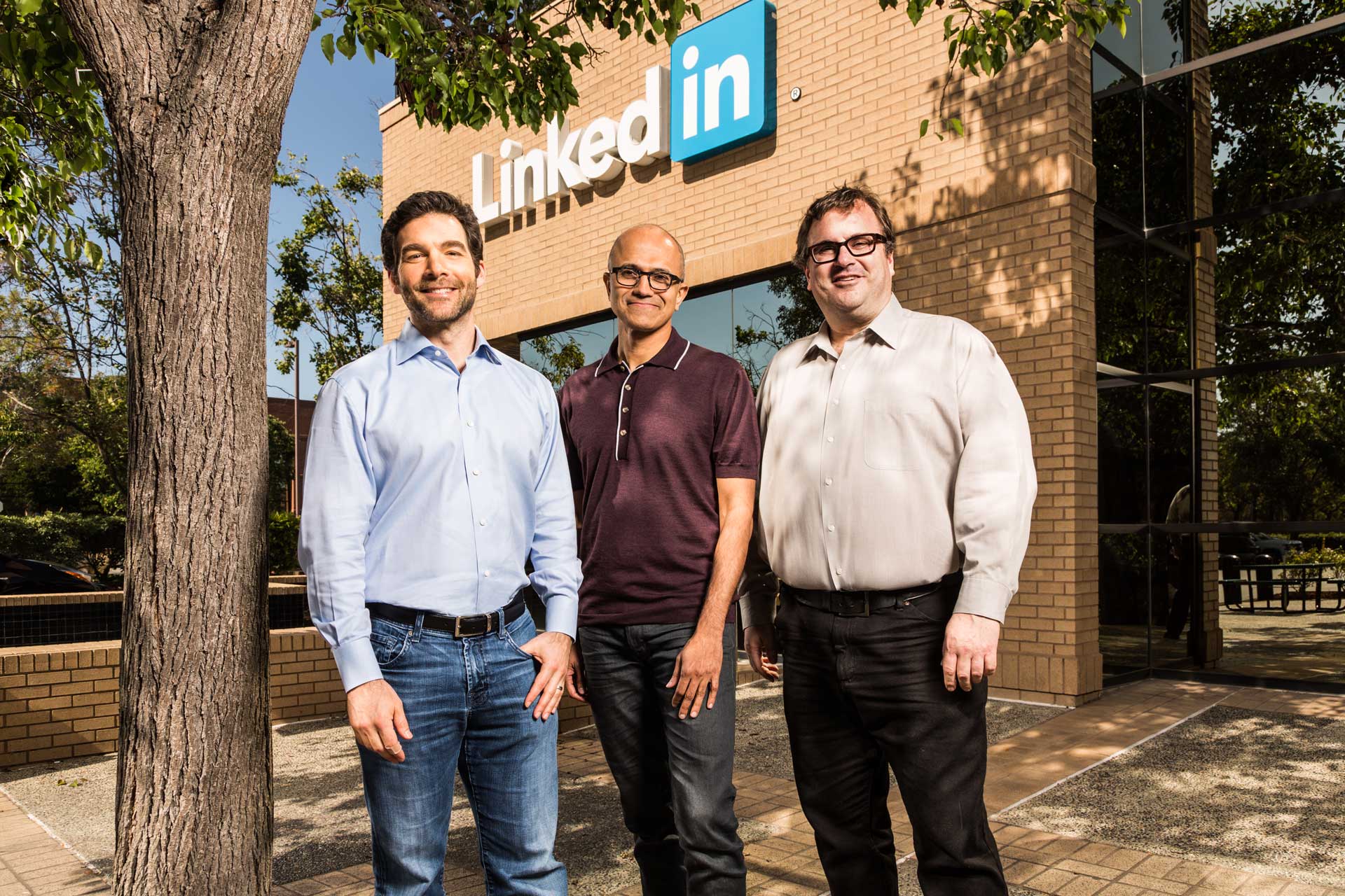 men standing in front of building with LinkedIn sign