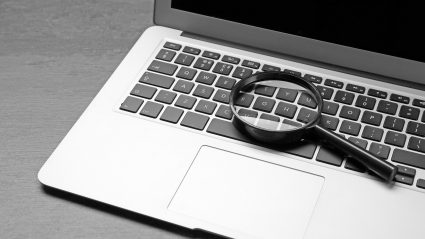 Computer keyboard with magnifying glass