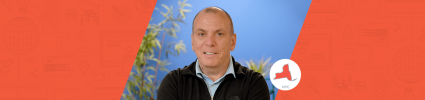 portrait photo of Wpromote employee Peter Petrou on blue background