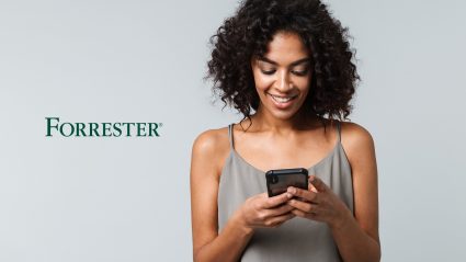 Woman looking at phone with Forrester logo