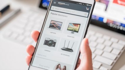 amazon on mobile device in persons hand
