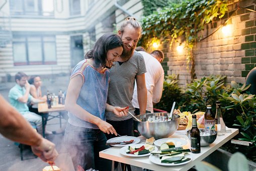 Residential community having dinner outside together