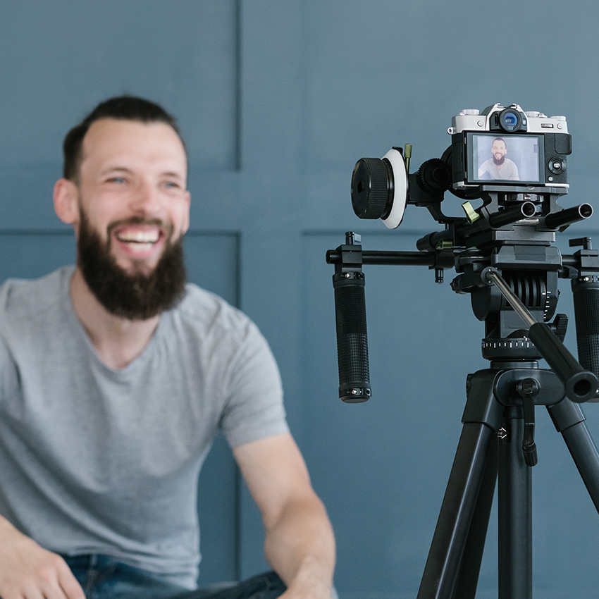 Male influencer in front of a camera