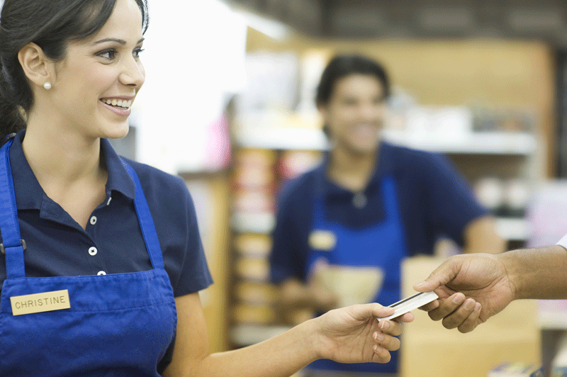 Store clerk accepting punch card