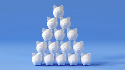 pyramid of white piggy banks on blue background
