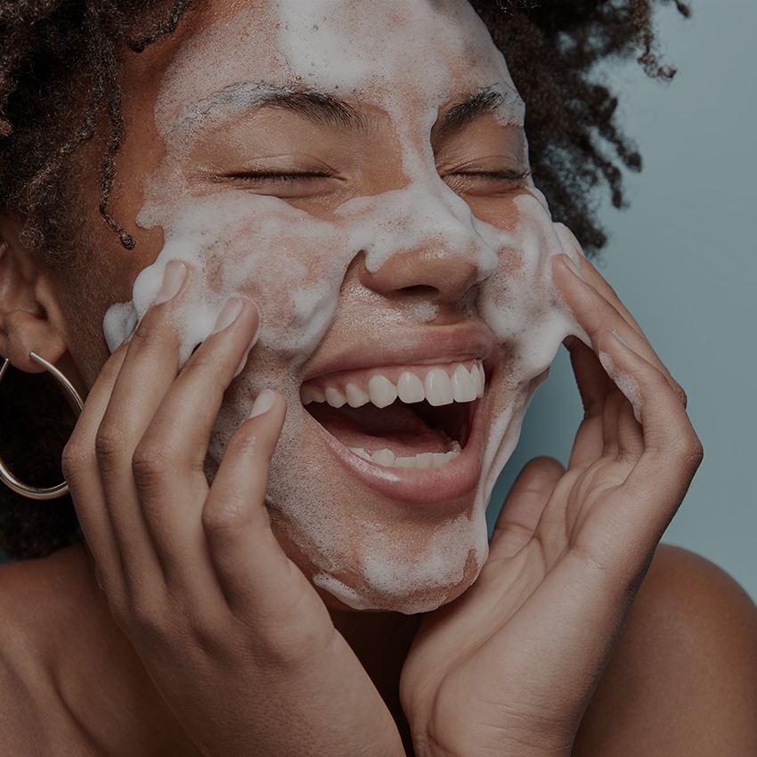 Woman washing face