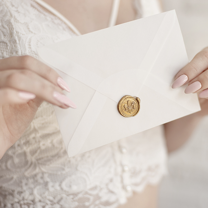 Bride holding invitation