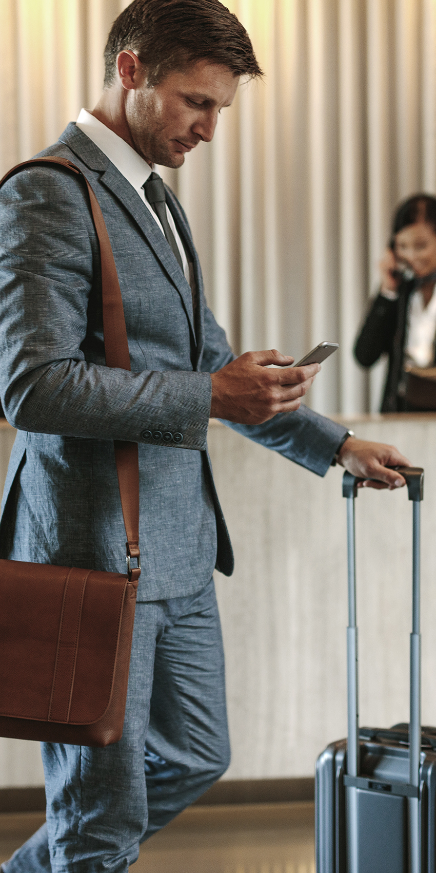 Man entering hotel lobby