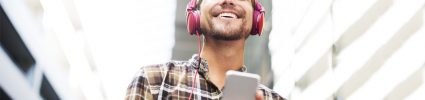 Young man listening to music on headphones