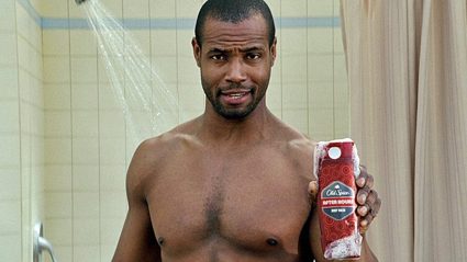 Man in shower holding Old Spice product