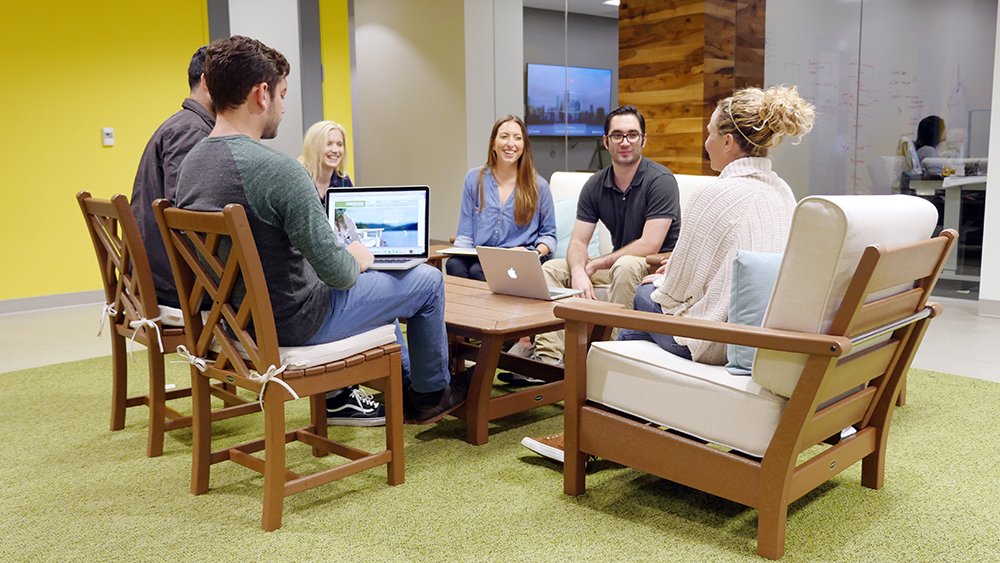 wpromote employees enjoying new POLYWOOD furniture in office