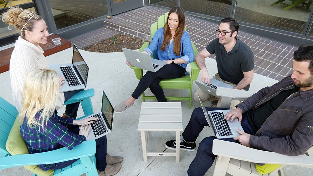 wpromote employees enjoying polywood furniture outside