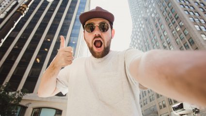 Man taking a selfie video of himself in the city