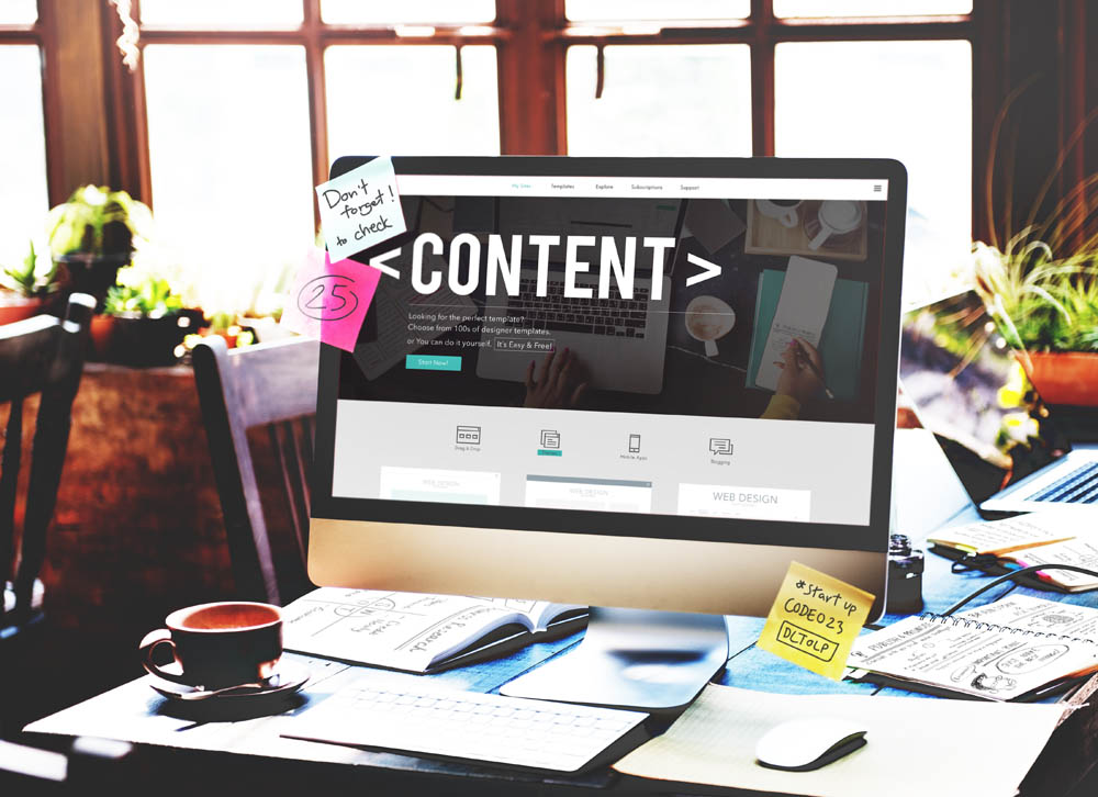 desk with computer screen showing the word content