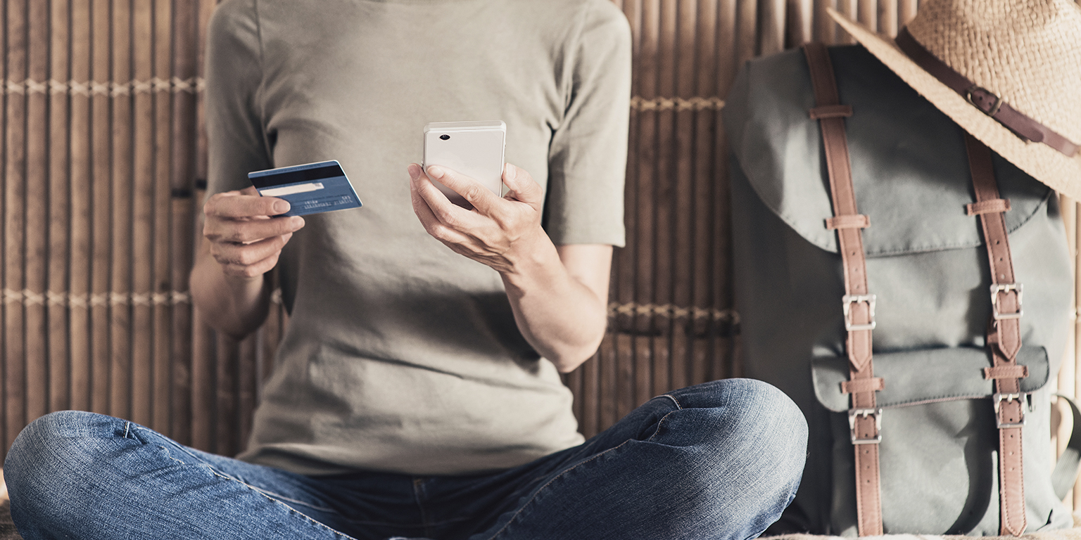 Traveler making online purchase