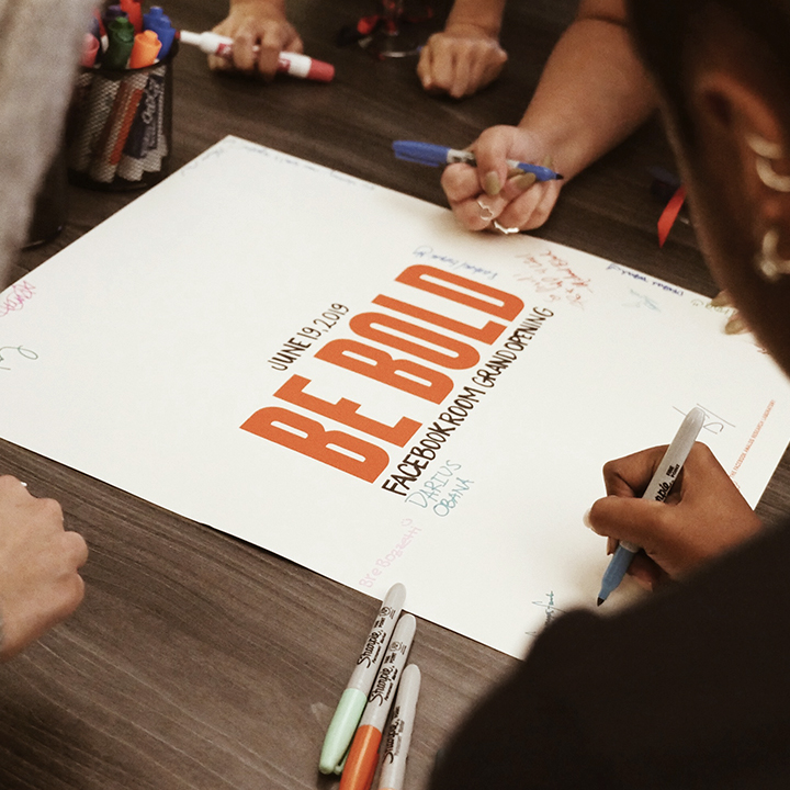 Writing on poster that says Be Bold