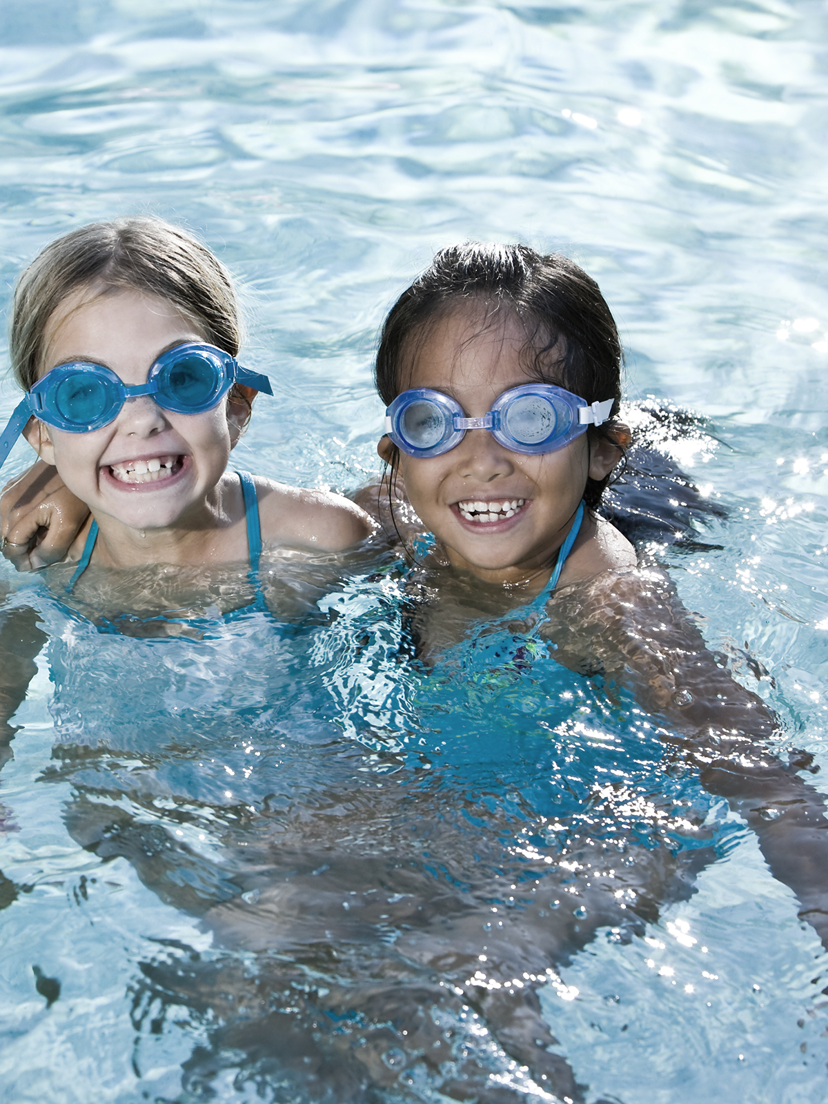 Two girls swimming in the pool