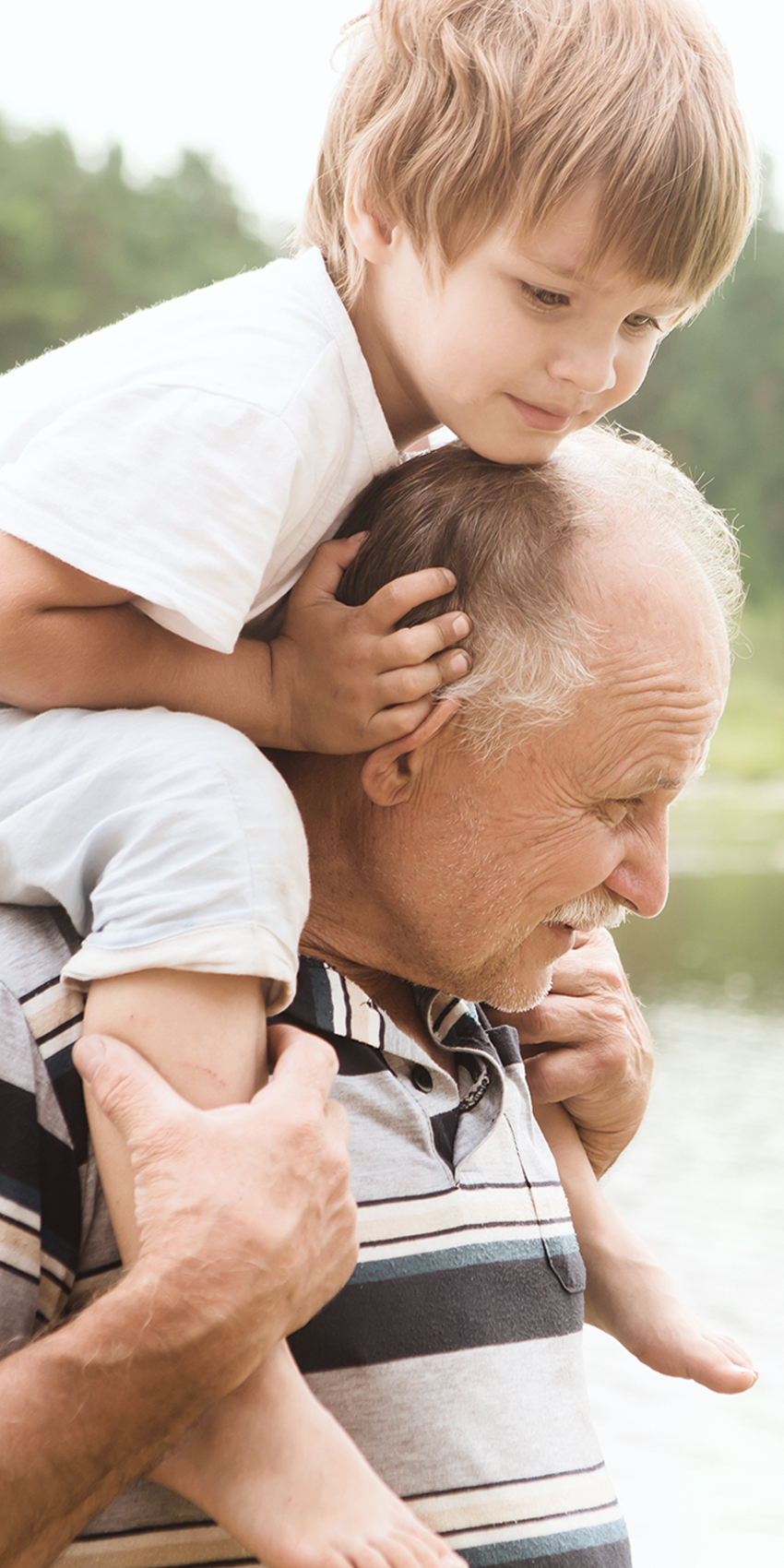 Grandpa with grandson on his shoulders