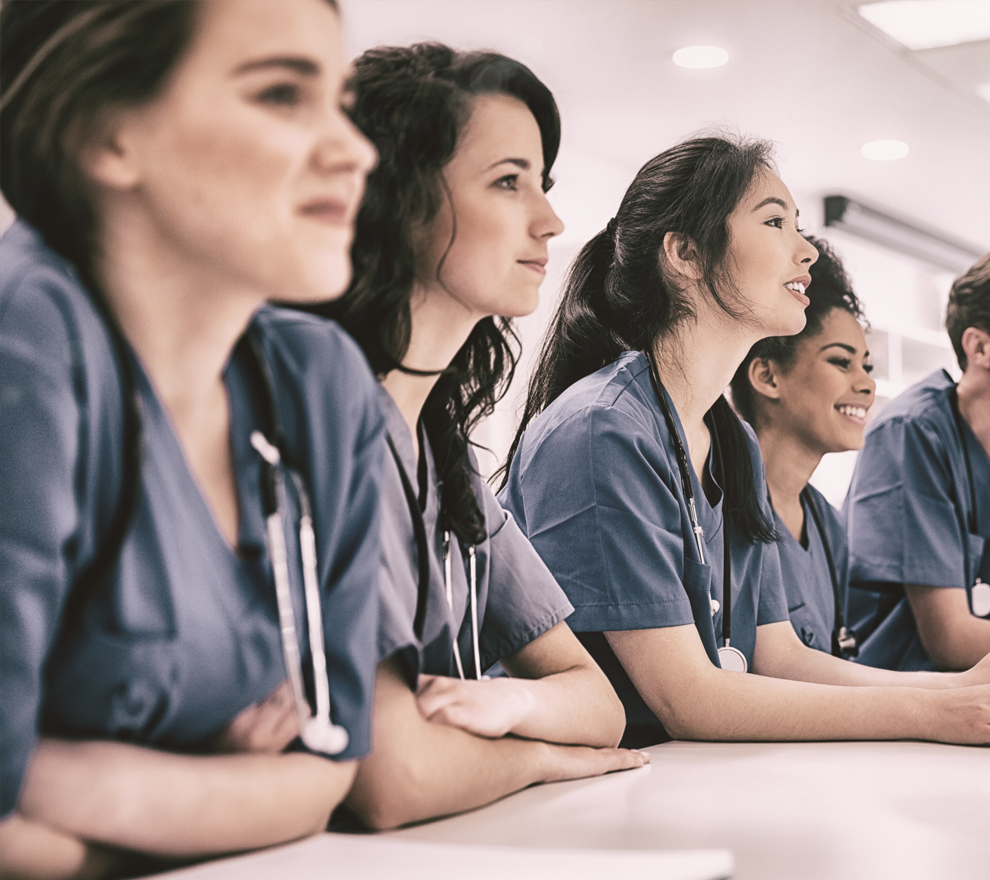 group of medical students sitting at desk