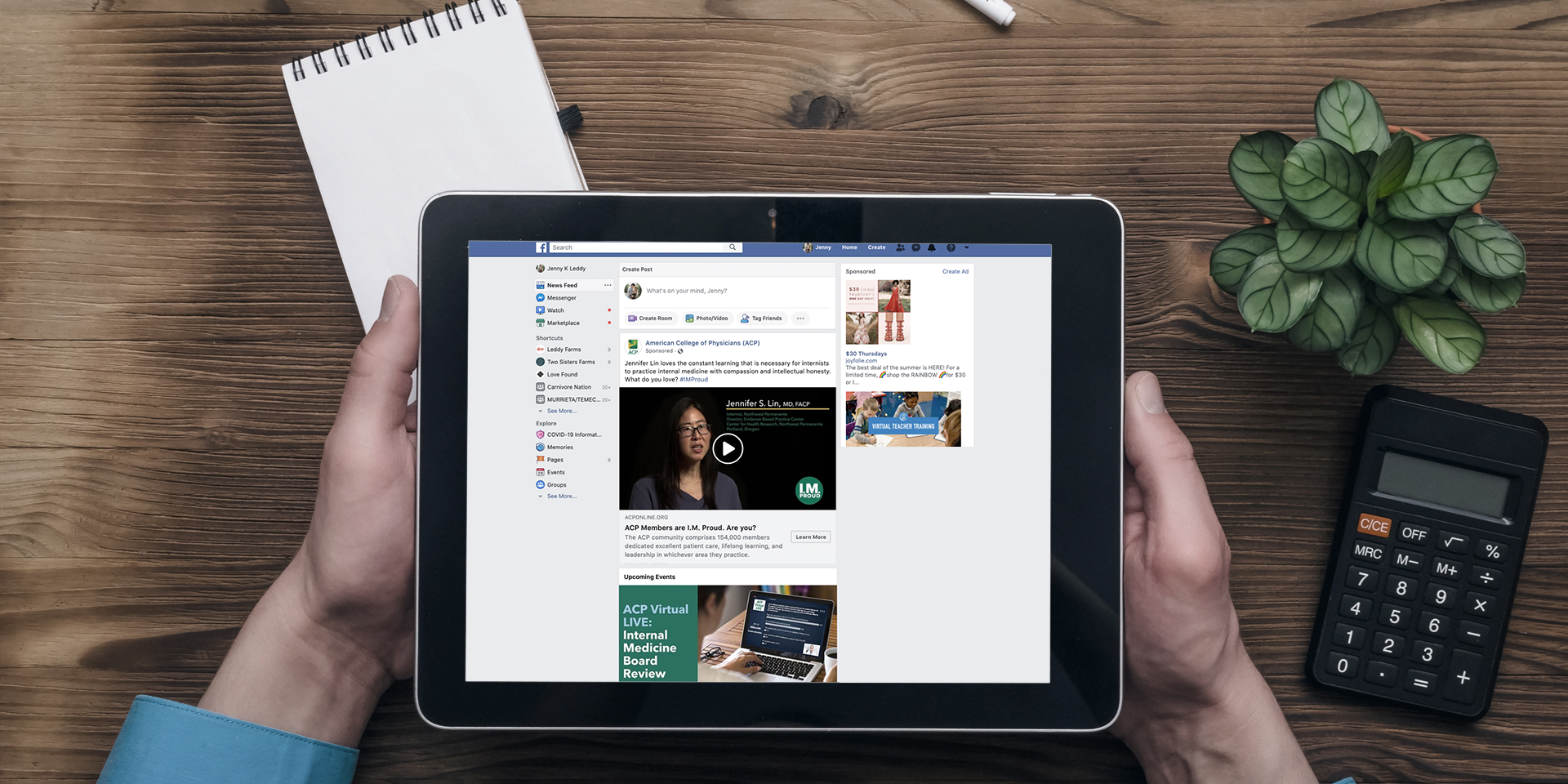 hands holding ipad with facebook on screen