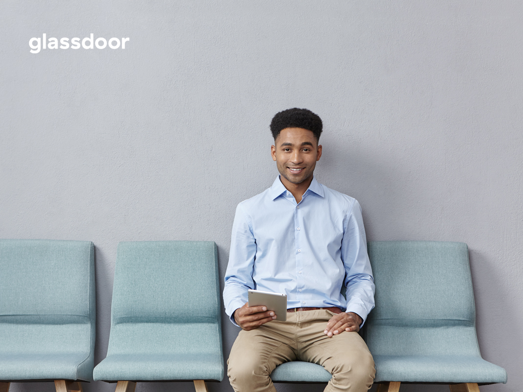 man sitting in chair waiting for interview