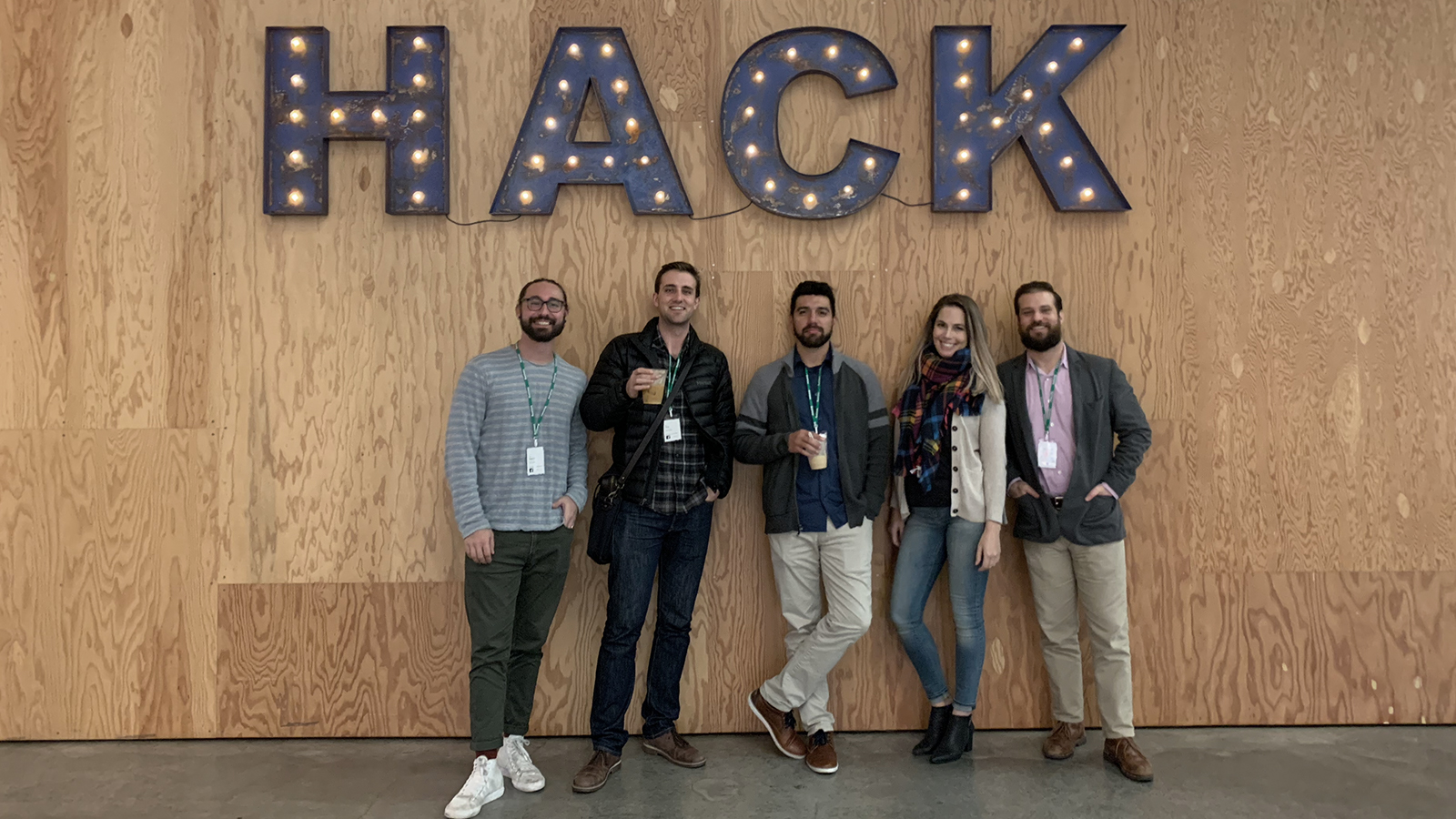 Group standing in front of HACK sign