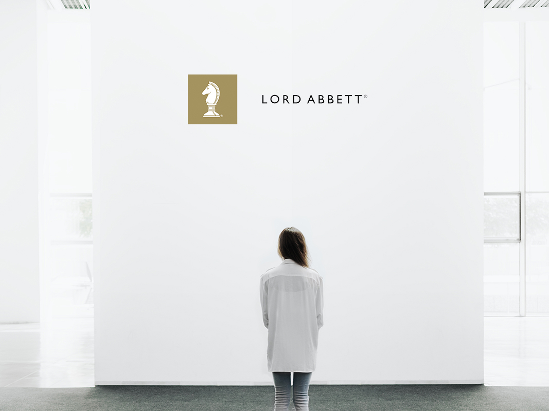 woman standing looking at blank wall