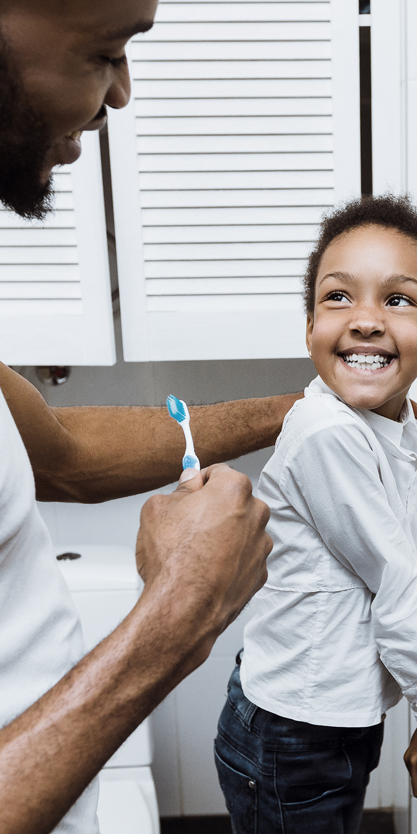 Father and son brushing teeth