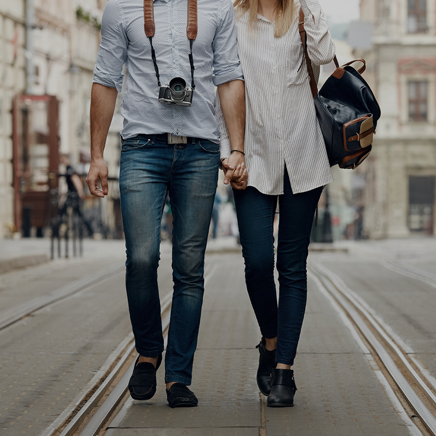 Tourist couple walking in the street