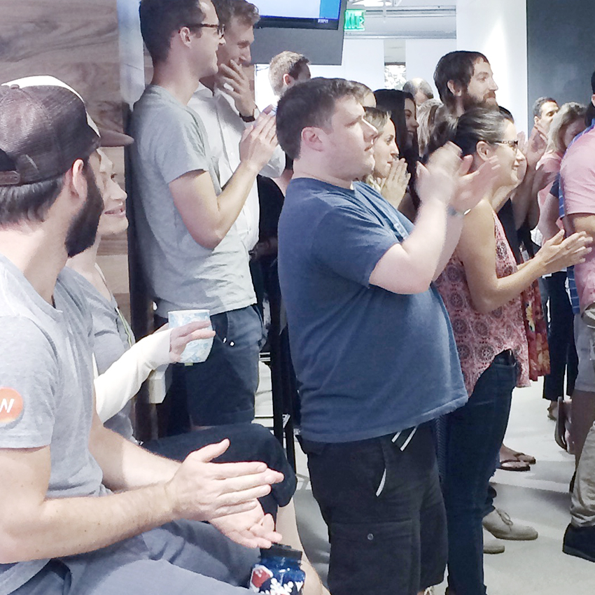Wpromote team clapping