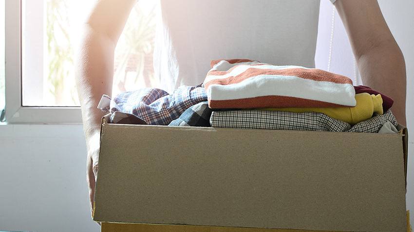 Carrying a box of clothes