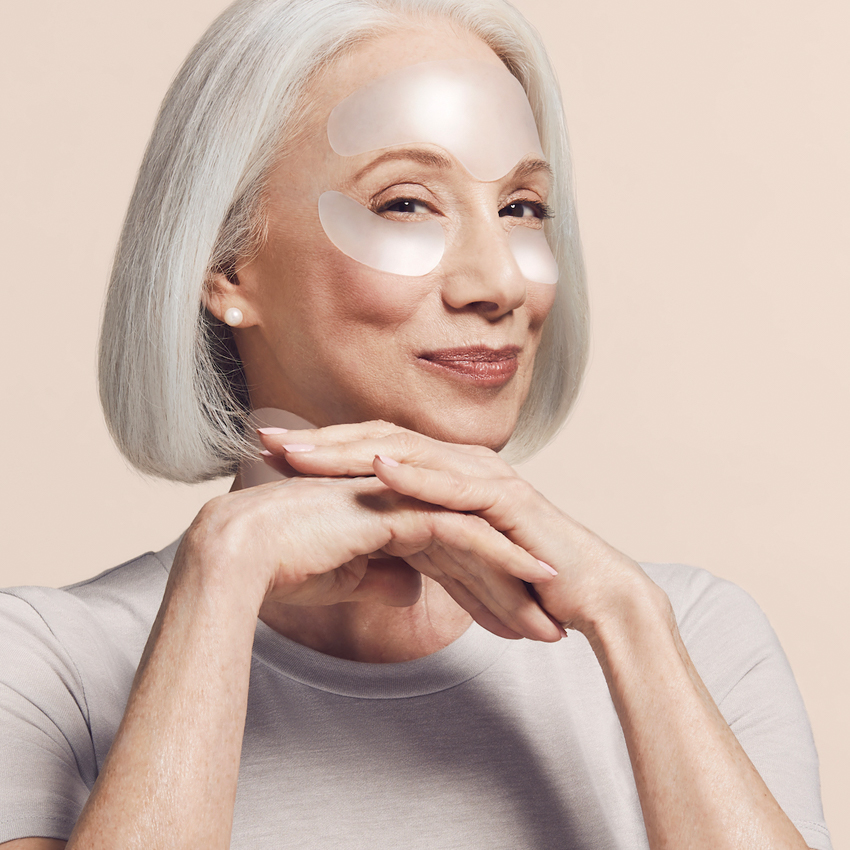 middle age woman with sio beauty products on face