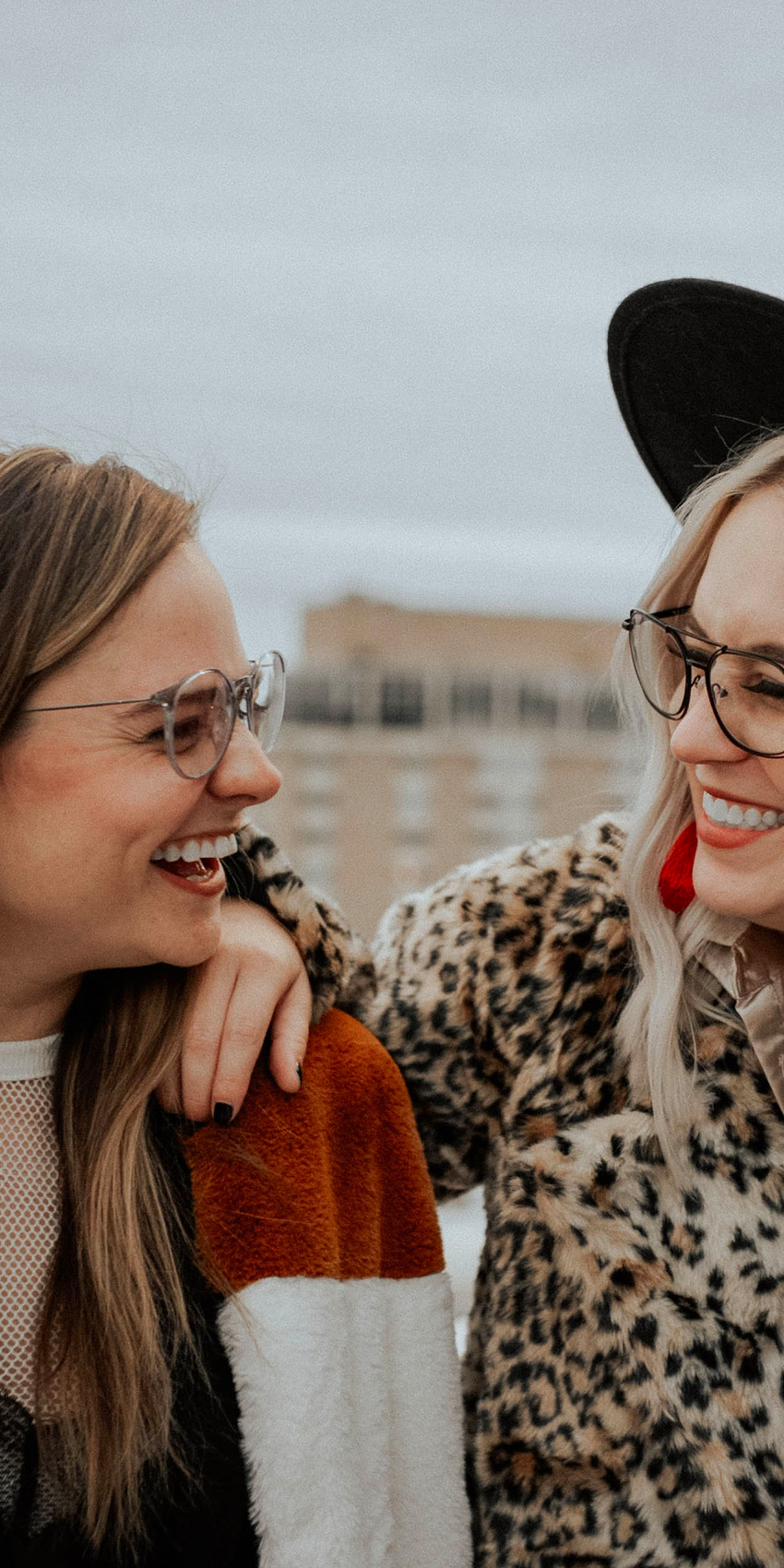 two women laughing in zenni glasses