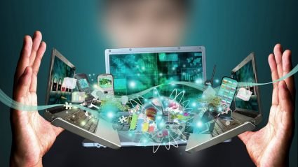 Person holding computer screens with various apps and websites hovering around
