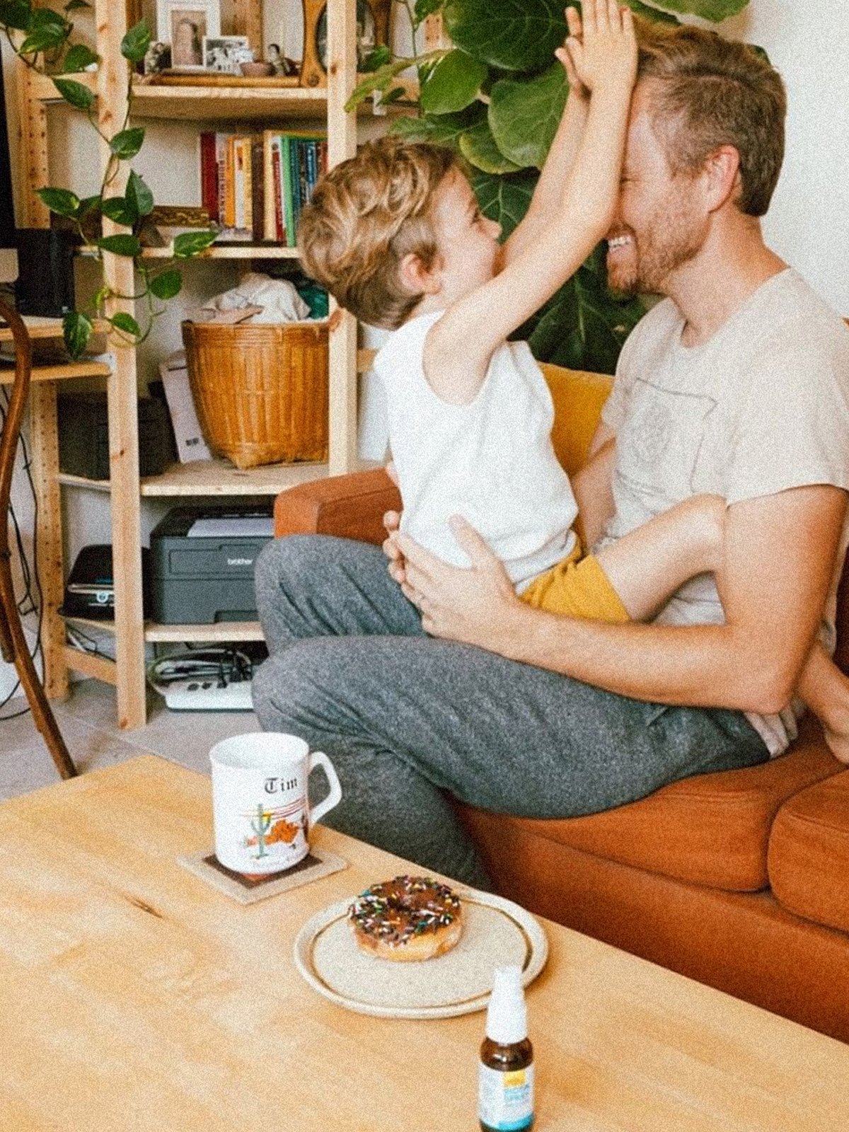 father and son in living room