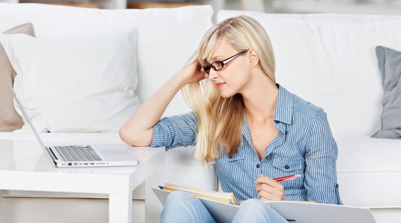 woman researching using laptop