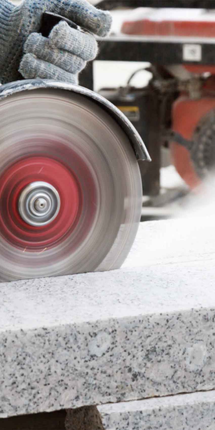 Close-up of saw cutting granite countertop