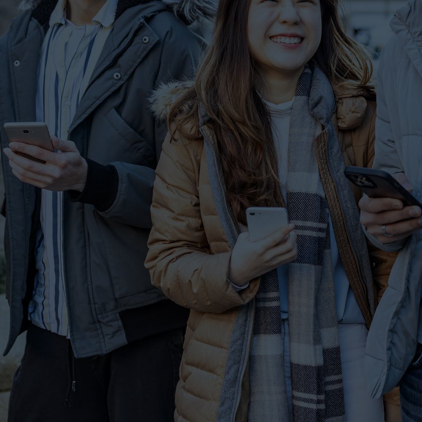 group of people holding phones