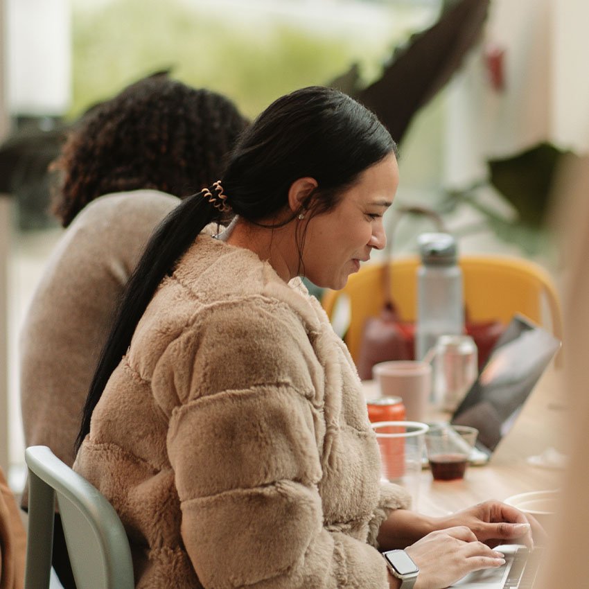 Wpromote employee working on their laptop